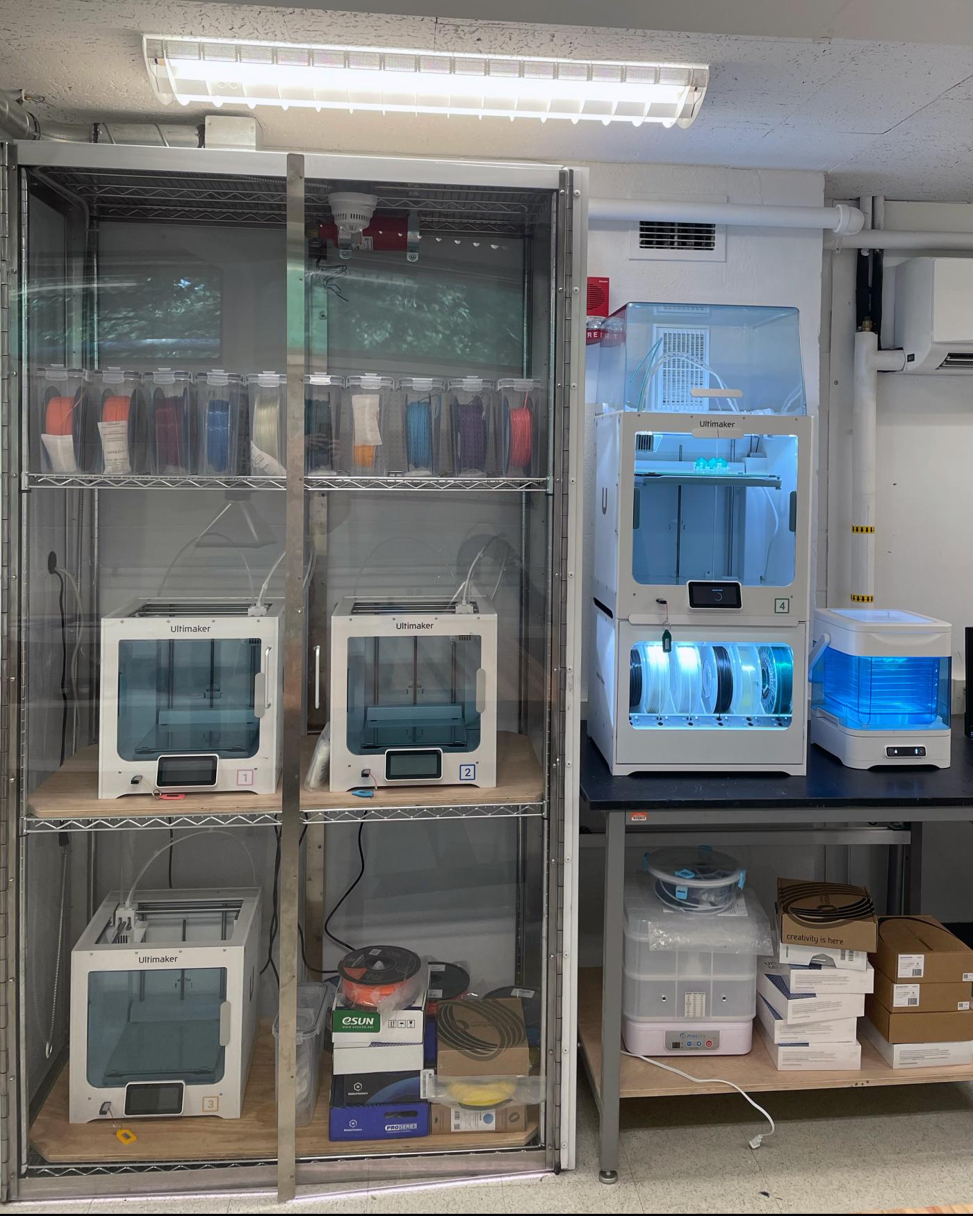 A wall of 3D printers in the Keller Center Makerspace