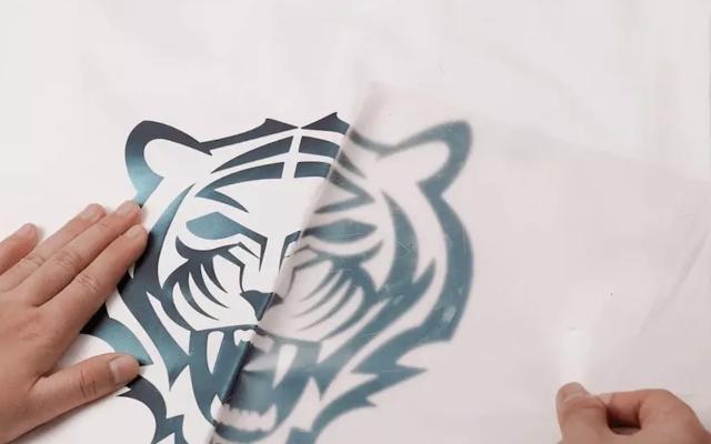 A vinyl transfer of a tiger head on a white t-shirt