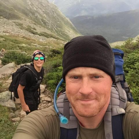 Photo of Jeff Phanuef hiking on a mountain