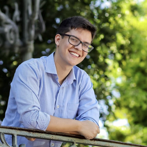 Happy student smiling in outdoor setting