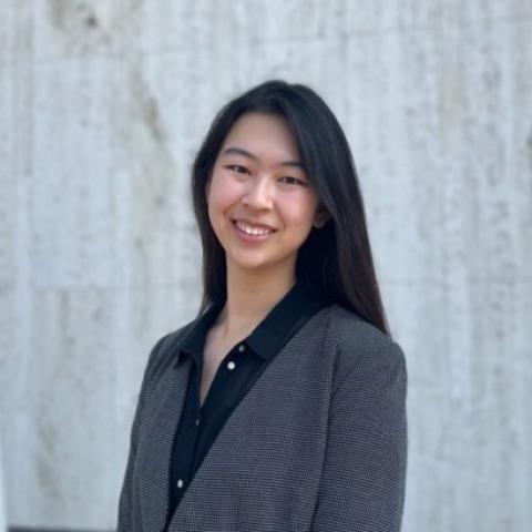 Sophie Li smiling in front of building