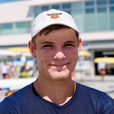 Smiling student outside at rowing event