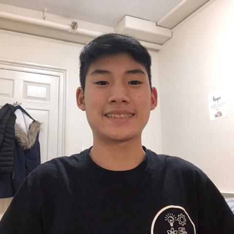 Smiling student in dorm room