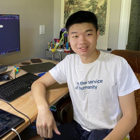 Smiling college student at desk