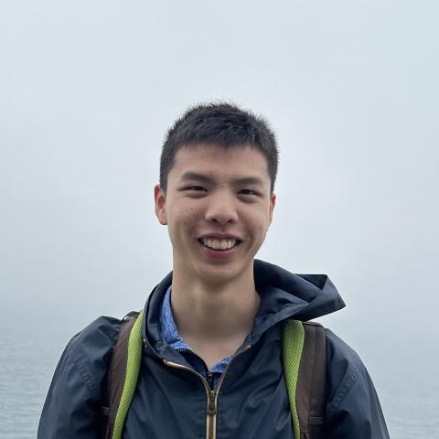 Student smiling while hiking outdoors