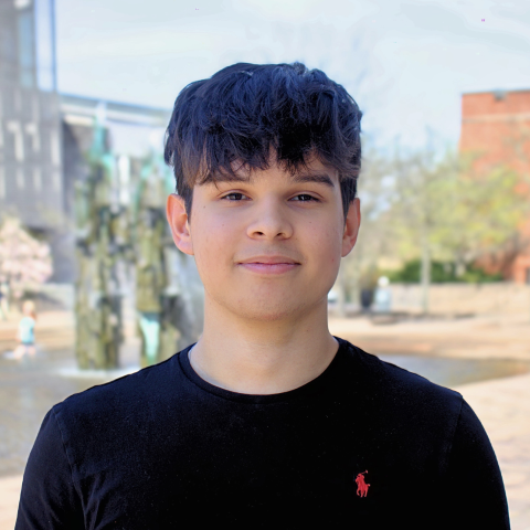 Student smiling outside